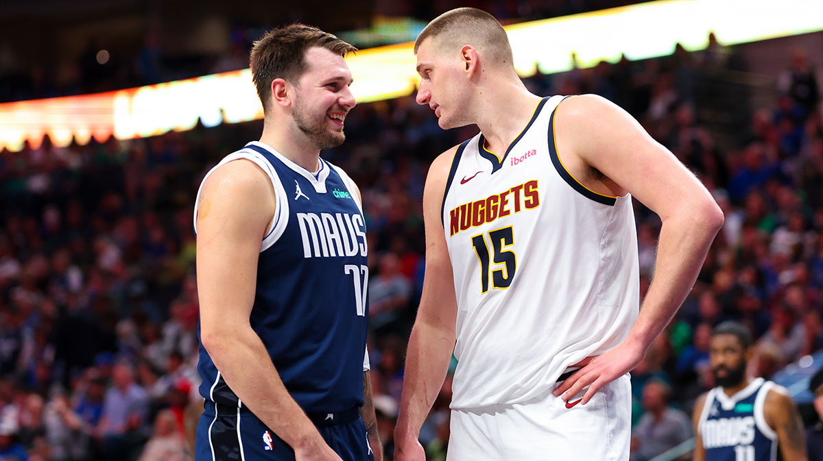 Dallas Mavericks goalkeeper Luka Doncic (77) speaks with the center of Denver Nuggets Nikola Jokic (15) during the second half at the American Airlines Center. 