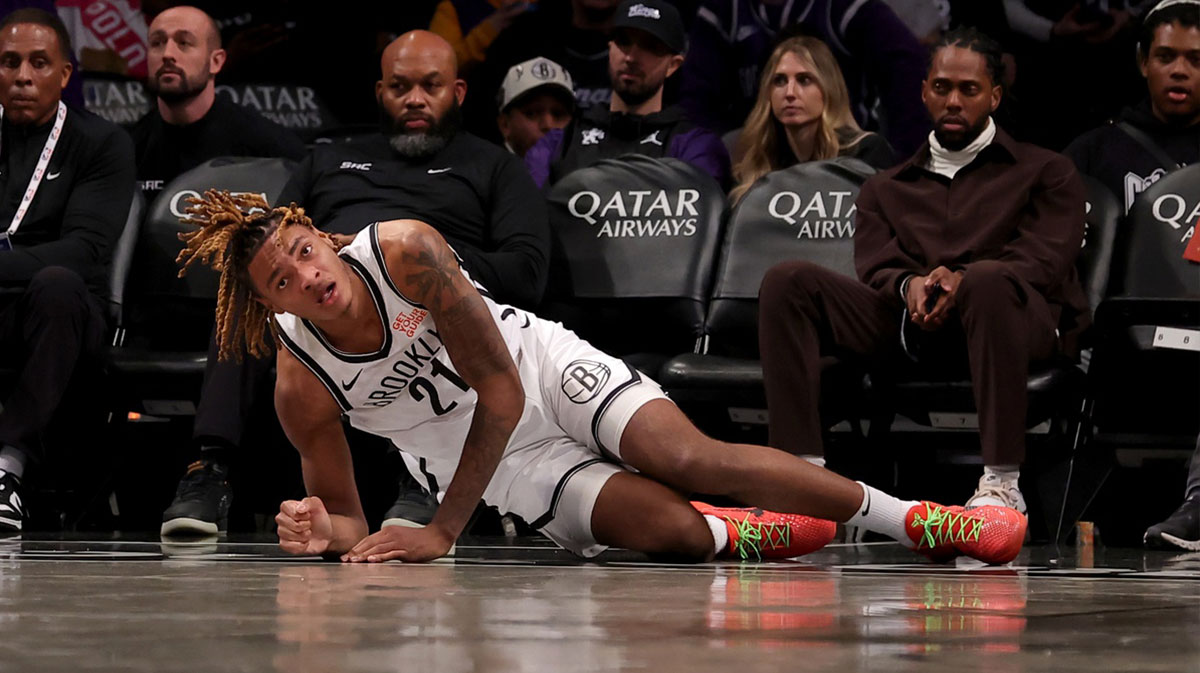 Brooklyn Networks Forward Noah Clavnei (21) reacts after the injury to the left ankle during the second quarter against Sacramento Kings in the center of Barclays.