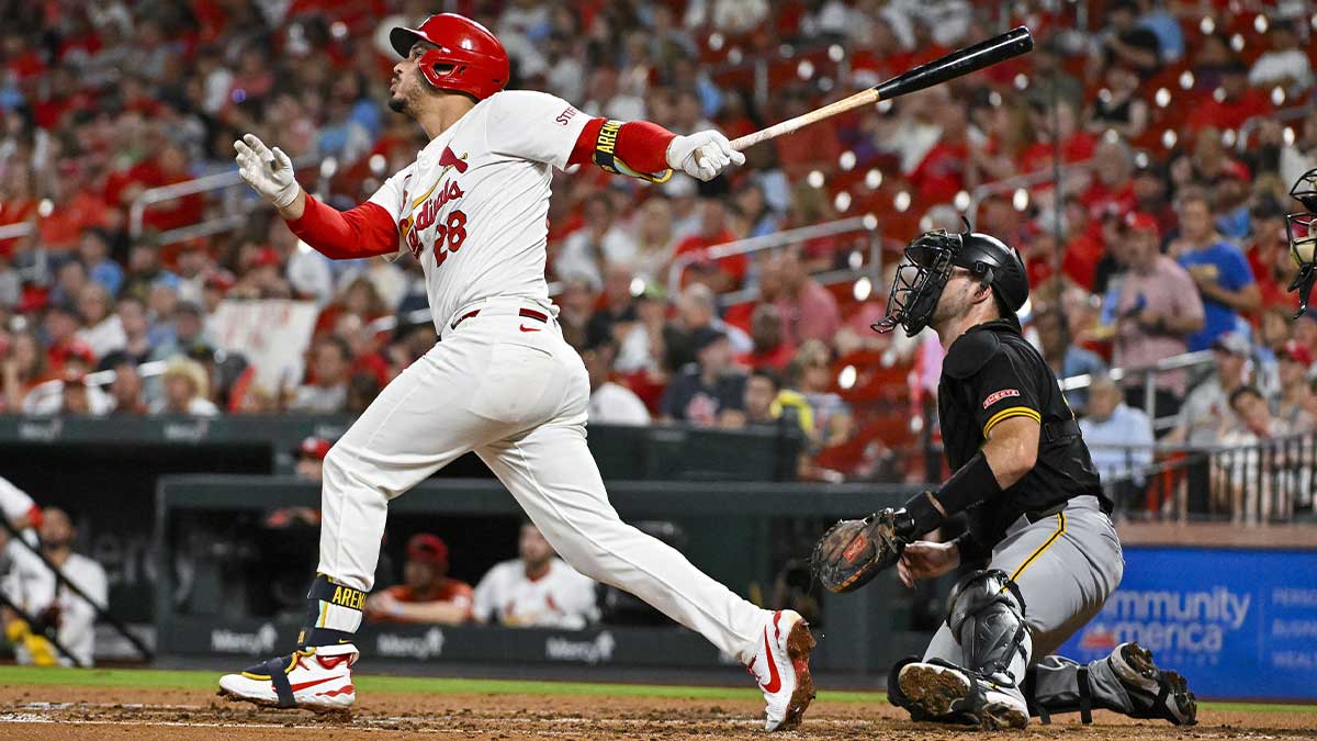 Sep 18, 2024; St. Louis, Missouri, USA; St. Louis Cardinals third baseman Nolan Arenado (28) hits a one run single against the Pittsburgh Pirates during the third inning at Busch Stadium.
