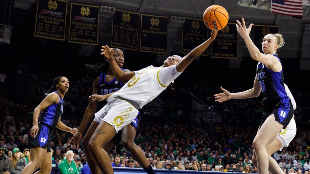 Notre Dame forward Liatu King (20) reaches out for a rebound during a NCAA women's basketball game between No. 1 Notre Dame and No. 11 Duke.