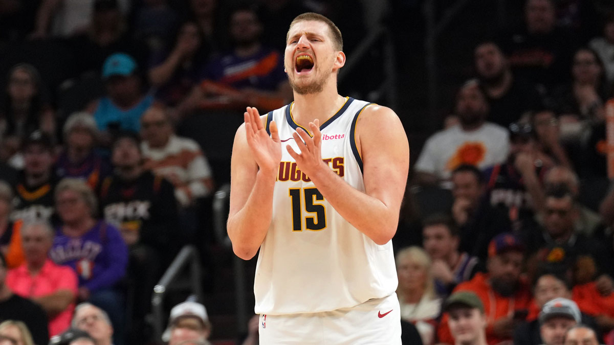 Denver Nuggets center Nikola Jokic (15) reacts against the Phoenix Suns during the second half at Footprint Center.