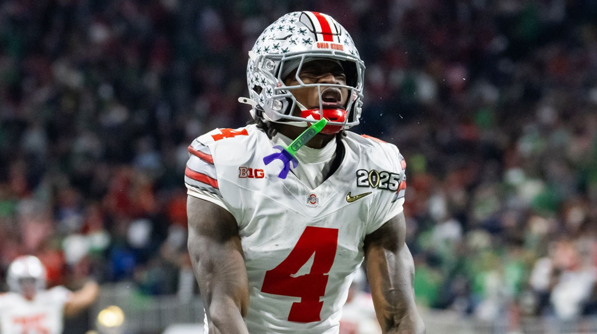 Ohio State Buckeyes wide receiver Jeremiah Smith (4) celebrates a play against the Notre Dame Fighting Irish during the CFP National Championship college football game at Mercedes-Benz Stadium. 