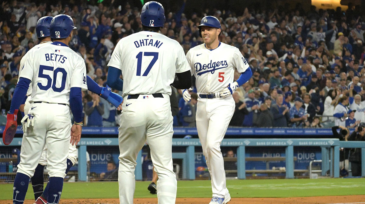 20. May 2024 years; Los Angeles, California, USA; Los Angeles Dodgers The first Baseman Freddie Freeman (5) is welcomed on the second Baseman Miguel Rojas (11), short-lived Hitter Shohei Ohtani (17), after strucking in the Grand Slam home in third place Arizona Diamondbacks in Dodger Stadium. 