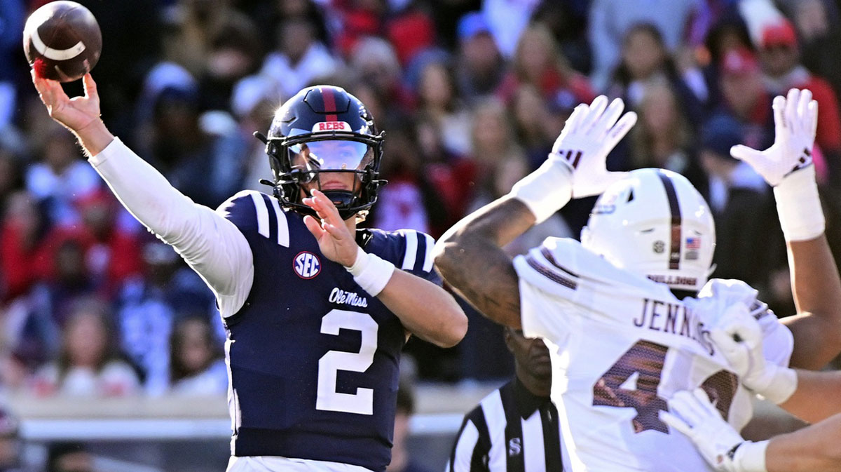 Mississippi Rebels quarterback Jaxson Dart (2) looks to pass while defended by Mississippi State Bulldogs linebacker Branden Jennings (44) during the first quarter at Vaught-Hemingway Stadium.