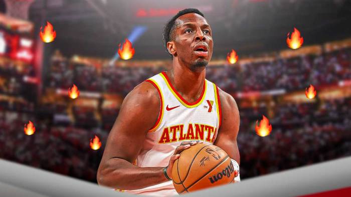 Onyeka Okongwu in a Hawks jersey with fire around him.
