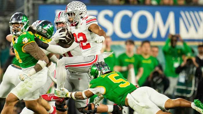 Ohio State Buckeyes running back TreVeyon Henderson (32) leaps over Oregon Ducks defensive back Kobe Savage (5) during the second half of the College Football Playoff quarterfinal at the Rose Bowl in Pasadena, Calif. on Jan. 1, 2025. Ohio State won 41-21.
