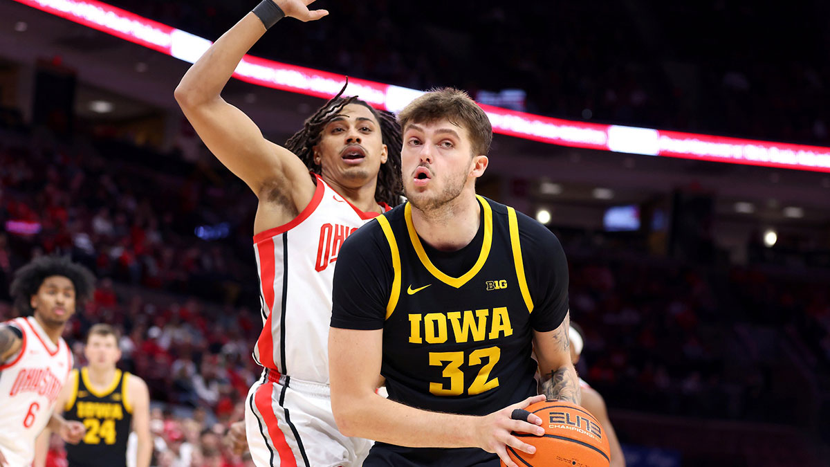 Iowa Hawkeyes forward Owen Freeman (32) controls the ball as Ohio State Buckeyes forward Devin Royal (21) defends during the first half at Value City Arena.