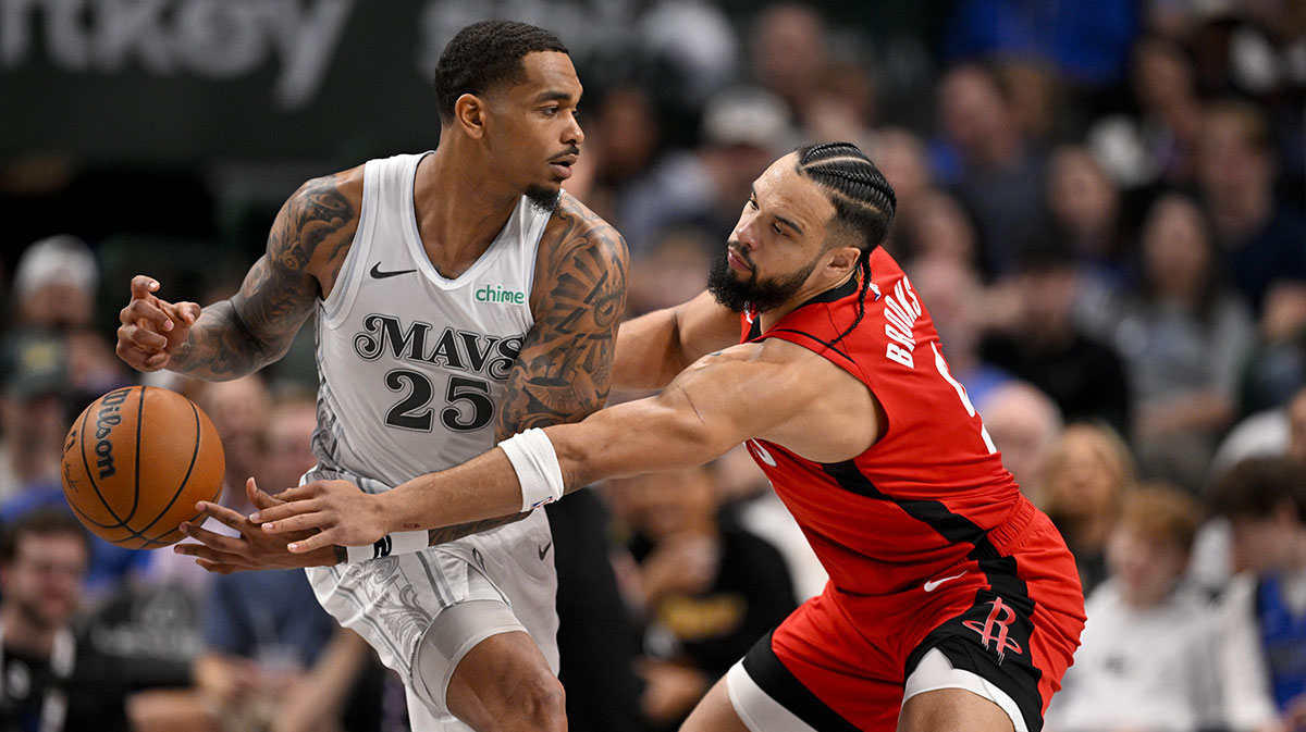 Dallas Mavericks forward P.J. Washington (25) and Houston Rockets forward Dillon Brooks (9) in action during the game between the Dallas Mavericks and the Houston Rockets at the American Airlines Center.