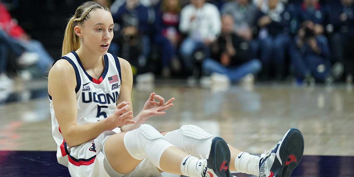UConn Huskies guard Paige Bueckers (5) reacts after her three point basket and being fouled by the Villanova Wildcats in the first half at Harry A. Gampel Pavilion.