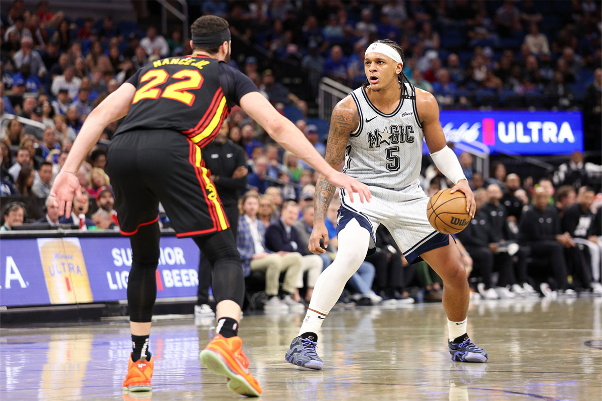 Orlando Magic Forward Paolo Banchero (5) Keep Atlanta Hawks Pread Larry Nance Jr. (22) In the third quarter in the Kia Center. 