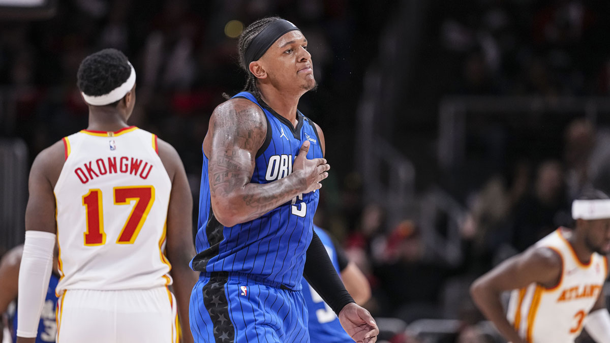 Orlando Magic Next Paolo Banchero (5) reacts after making a three-day basket late in the game against Atlant Hawks during the second half at the State Farm Arena.