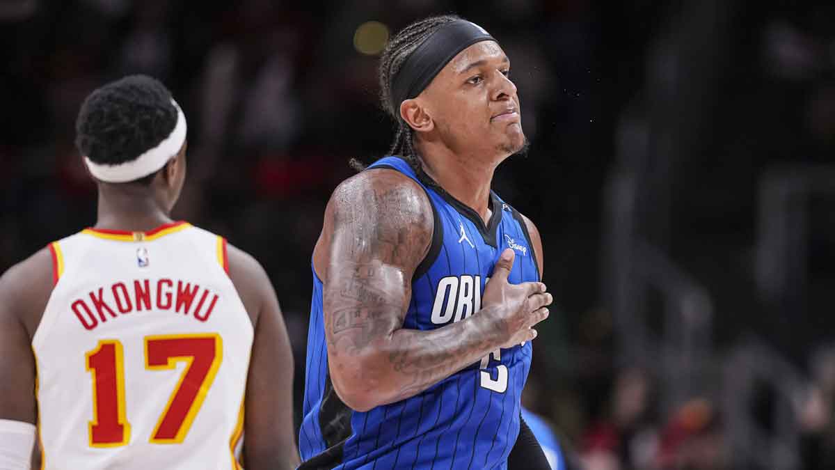 Orlando Magic forward Paolo Banchero (5) reacts after making a three point basket late in the game against the Atlanta Hawks during the second half at State Farm Arena.