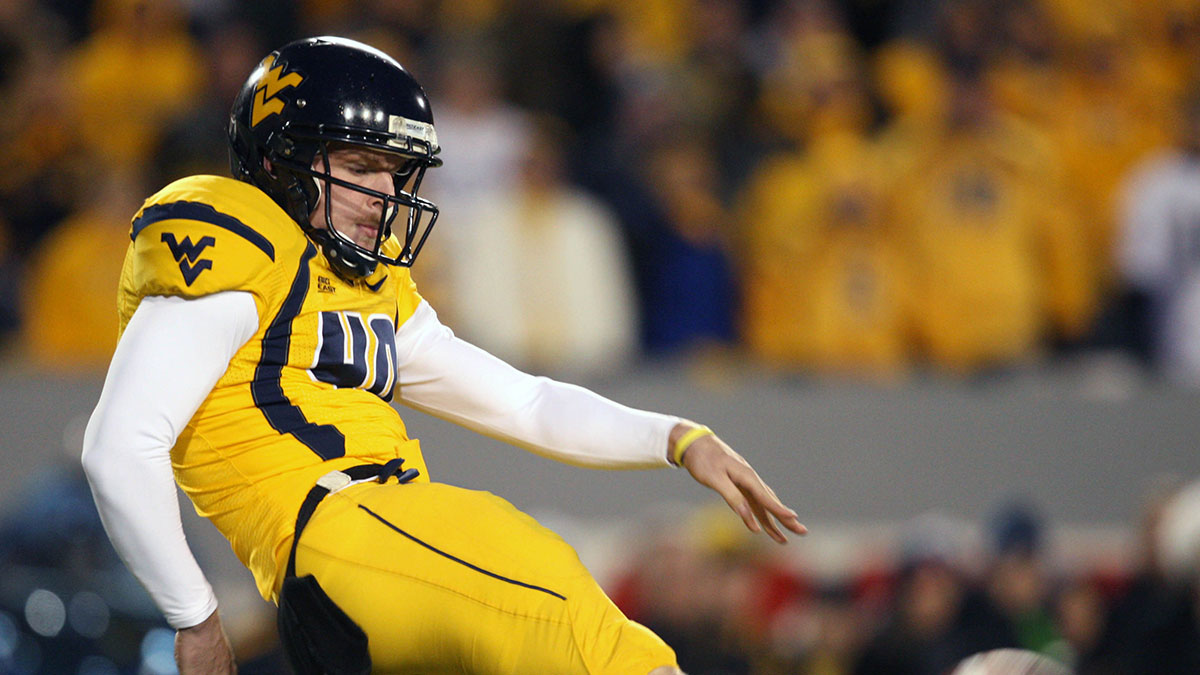 West Virginia Mountaineers kicker (40) Pat McAfee punts in the West Virginia Mountaineers 13-9 loss to the Pittsburgh Panthers at Mylan Puskar Stadium. Duhart recovered the fumble.
