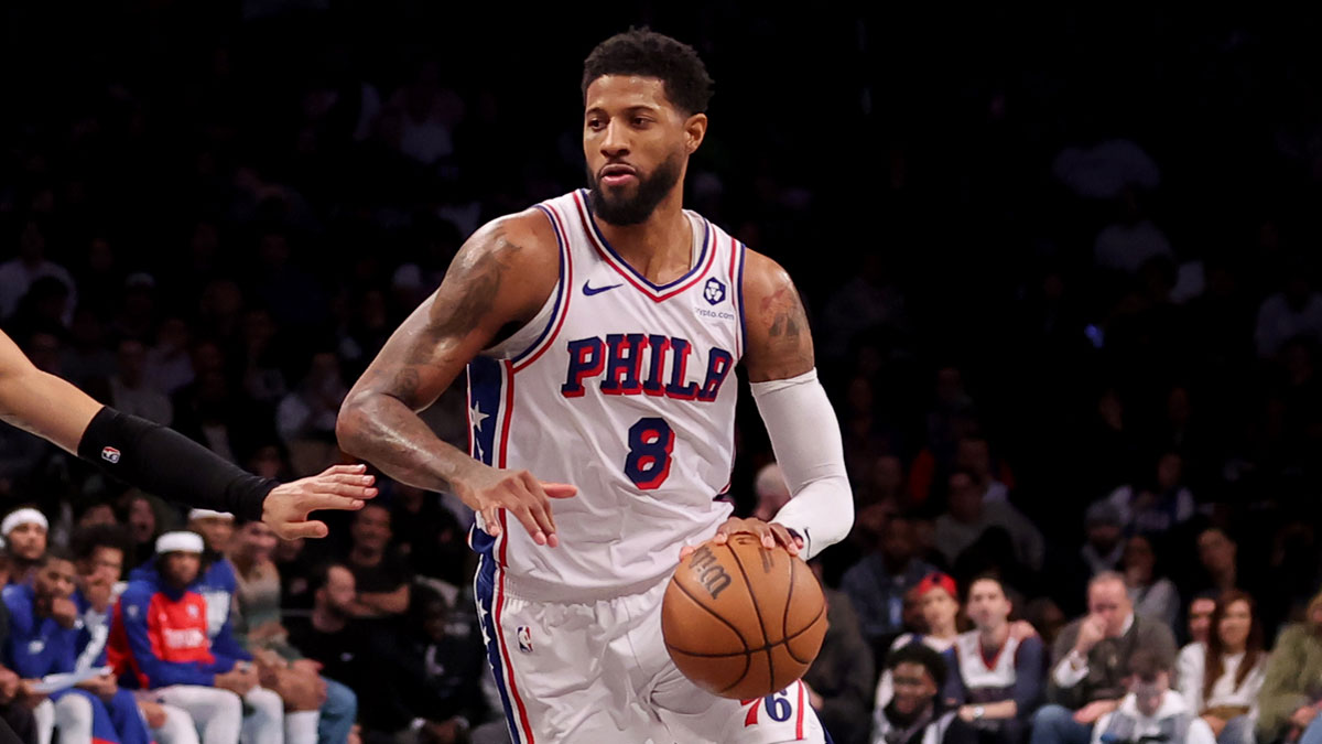 Philadelphia 76ers forward Paul George (8) brings the ball up court against Brooklyn Nets forward Jalen Wilson (22) during the fourth quarter at Barclays Center.