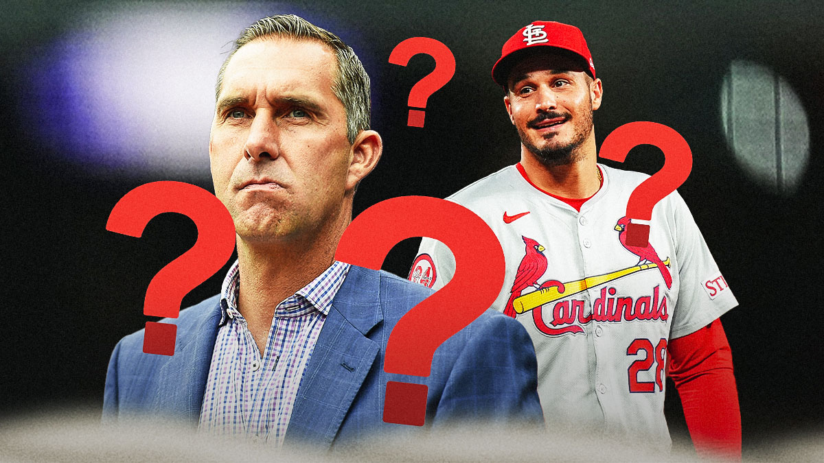 Cardinals GM John Mozeliak standing next to Nolan Arenado and question marks