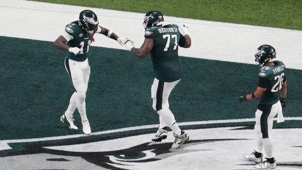 Philadelphia Eagles wide receiver A.J. Brown (11) celebrates his touchdown with Philadelphia Eagles offensive tackle Mekhi Becton (77) against the Kansas City Chiefs in there second quarter during Super Bowl LIX at Caesars Superdome.