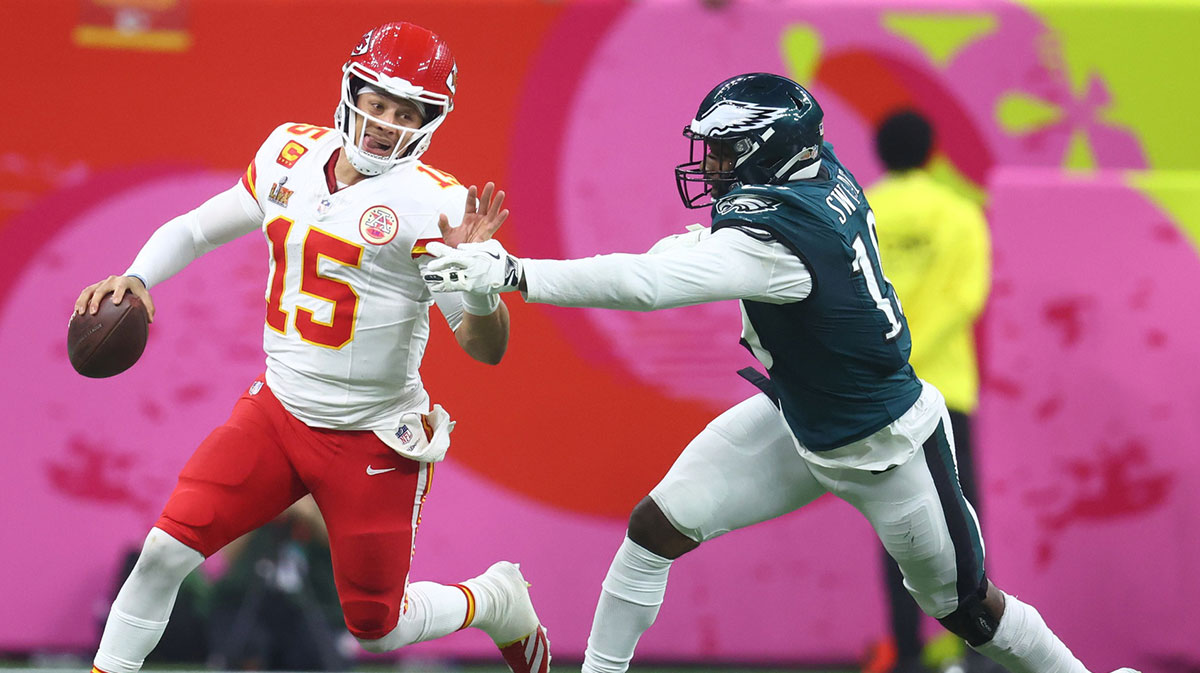 Kansas City Chiefs quarterback Patrick Mahomes (15) is tackled by Philadelphia Eagles linebacker Josh Sweat (19) in Super Bowl LIX between the Philadelphia Eagles and the Kansas City Chiefs at Ceasars Superdome.