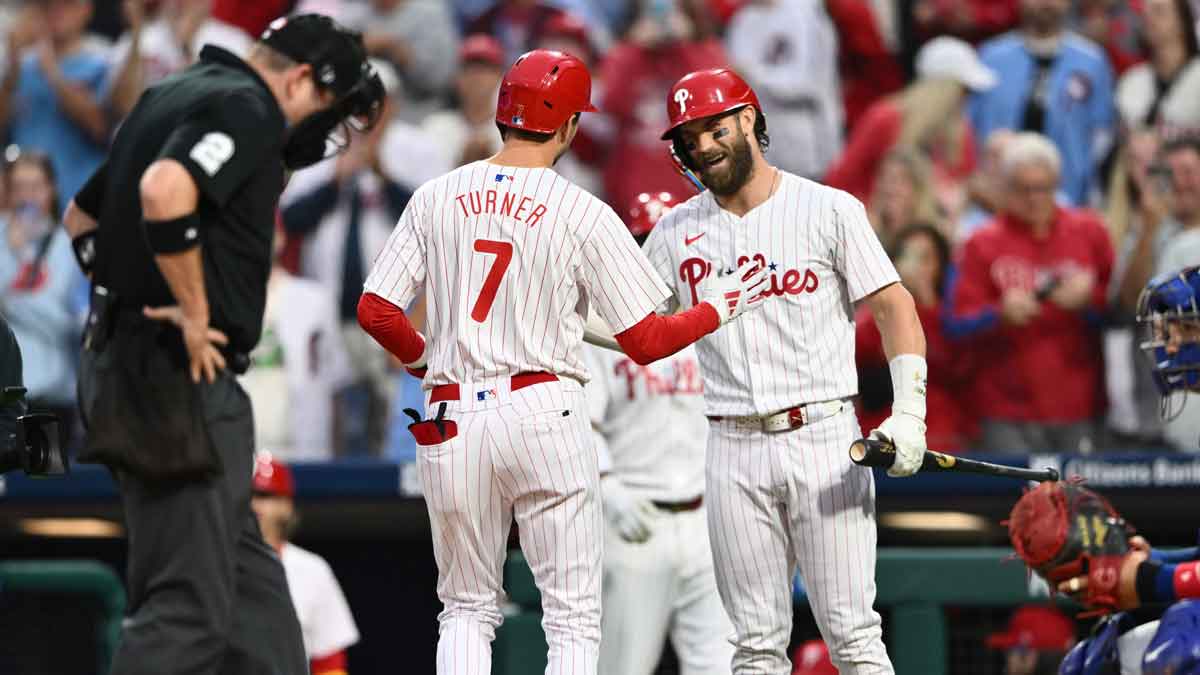 Philadelphia Phillies shortstop Trea Turner (7) reacts with first baseman Bryce Harper (3) after hitting a home run against the Chicago Cubs in the first inning at Citizens Bank Park.