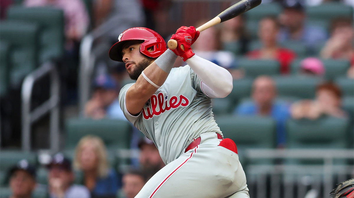 Philadelphia Phillies catcher Rafael Marchan (13) hits a single against the Atlanta Braves in the second inning at Truist Park.