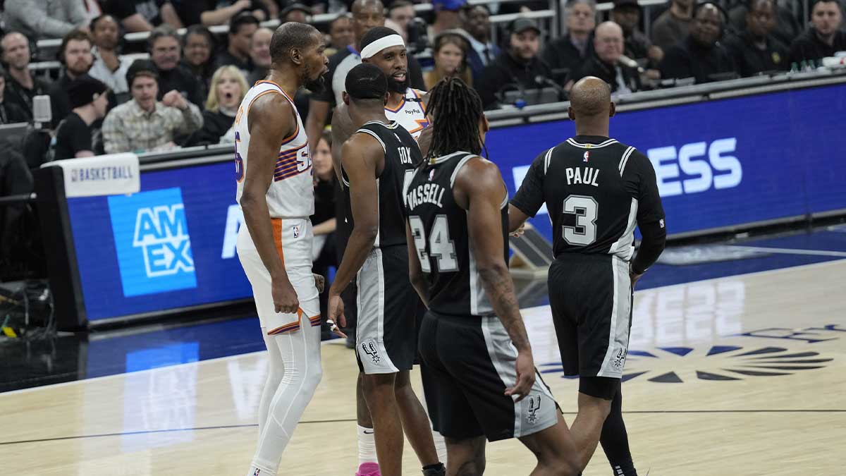 Phoenix Suns forward, Kevin Durant (35) and San Antonio Spurs Guard Chris Paul (3) exchange words during the first half in Moody Center.