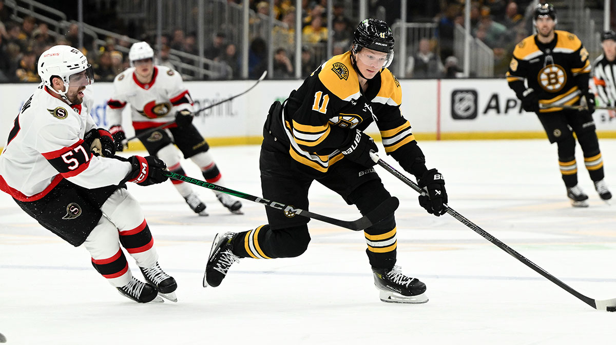 Boston Bruins center Trent Frederic (11) skates against the Ottawa Senators during the third period at the TD Garden. 