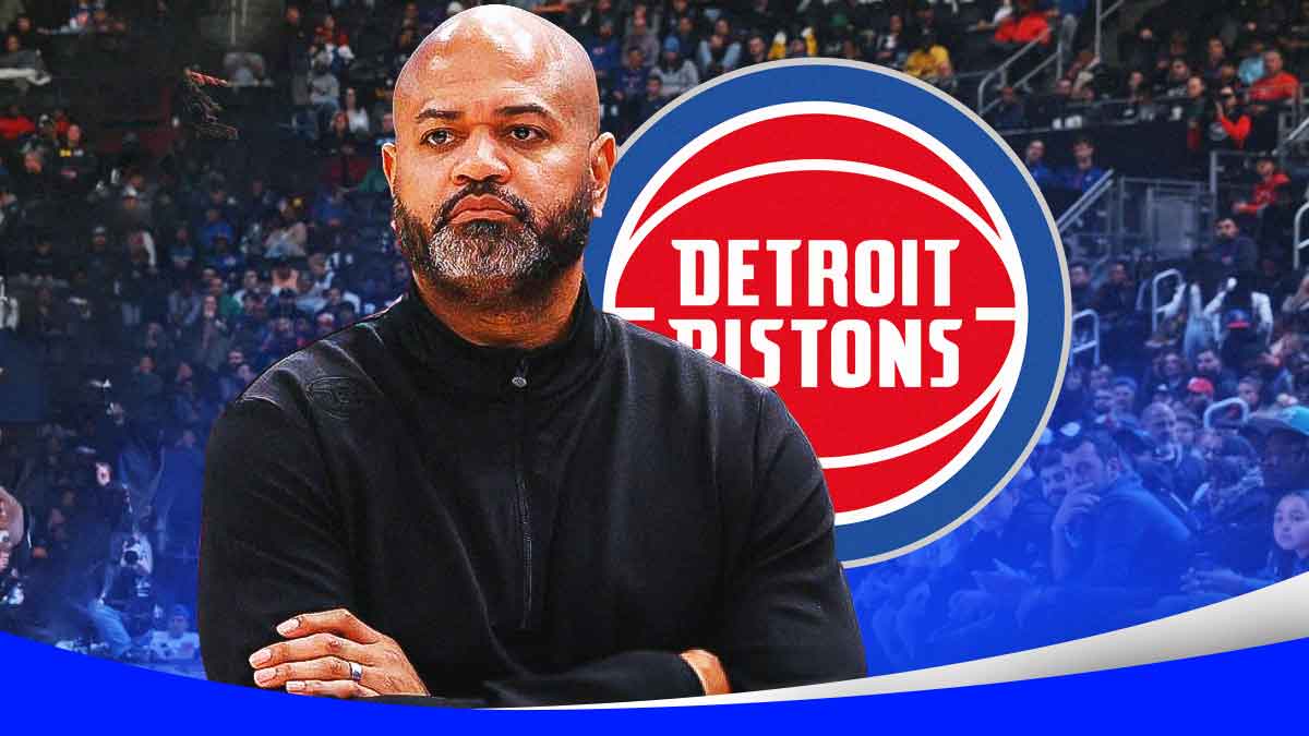 JB Bickerstaff looking serious next to a Pistons logo