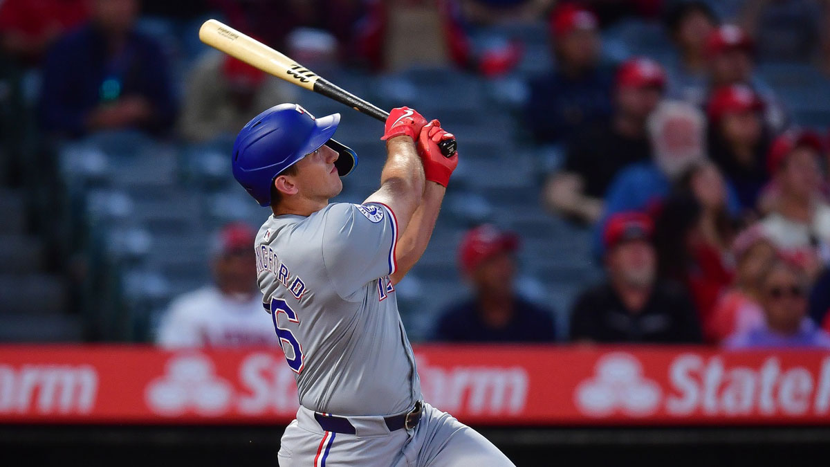 Texas Rangers center fielder Wyatt Langford (36) hits a two run home run against the Los Angeles Angels during the first inning at Angel Stadium.