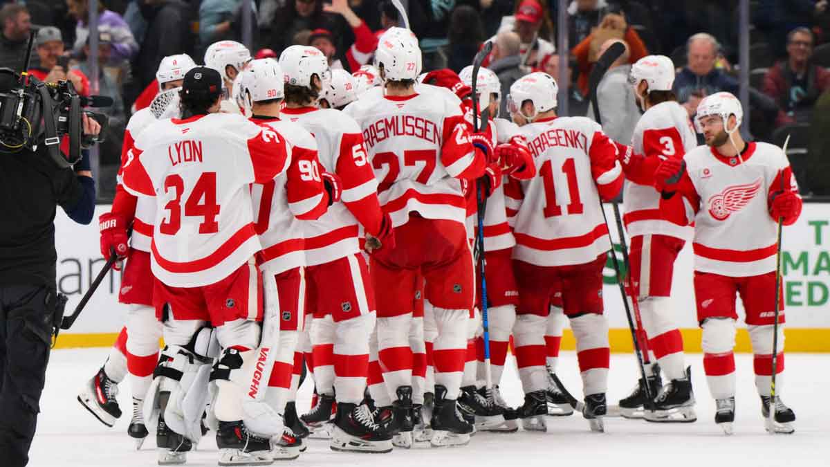 The Detroit Red Wings celebrate defeating the Seattle Kraken at Climate Pledge Arena.