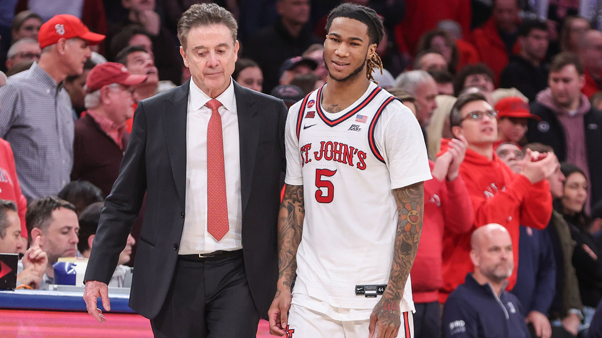 Feb 16, 2025; Queens, New York, USA; St. John's Red Storm guard Deivon Smith (5) walks to the bench with head coach Rick Pitino in the second half against the Creighton Bluejays at Madison Square Garden. Mandatory Credit: Wendell Cruz-Imagn Images