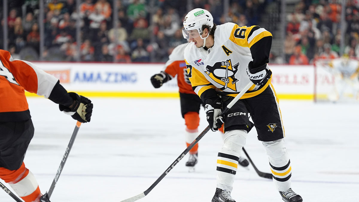 Pittsburgh Penguins right wing Rickard Rakell (67) controls the puck against the Philadelphia Flyers in the third period at Wells Fargo Center.