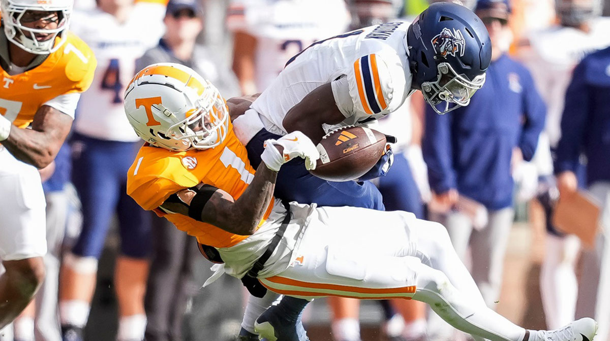 Tennessee defensive back Rickey Gibson III (1) strips the ball away from UTEP wide receiver Trey Goodman (1) during a college football game between Tennessee and UTEP at Neyland Stadium