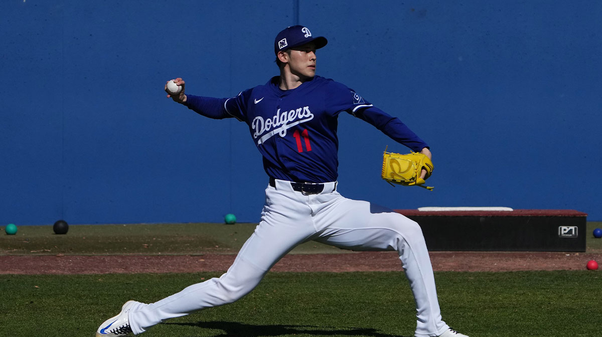 Los Angeles Dodgers Pitcher Roki Sasaki throws up during spring training in Camelback ranch.