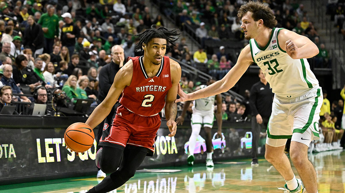 Rutgers Scarlet Knights guard Dylan Harper (2) drives to the basket against Oregon Ducks center Nate Bittle (32) during the second half at Matthew Knight Arena.