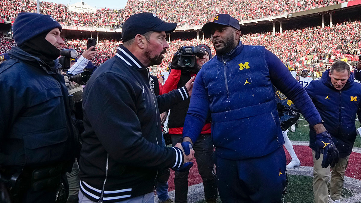 Ohio State Buckeyes head coach Ryan Day shakes hands with Michigan Wolverines head coach Sherrone Moore following the NCAA football game at Ohio Stadium