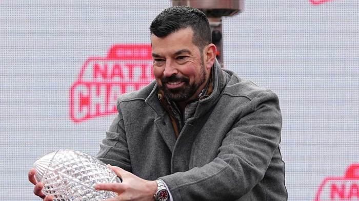 Ohio State Buckeyes head coach Ryan Day holds the Coaches' Trophy during the Ohio State Buckeyes College Football Playoff National Championship celebration at Ohio Stadium in Columbus on Jan. 26, 2025.