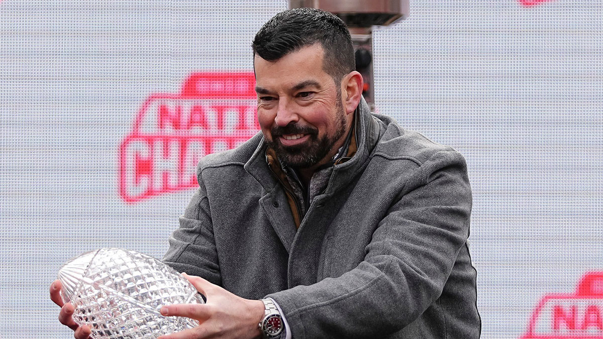 Ohio State Buckeyes head coach Ryan Day holds the Coaches' Trophy during the Ohio State Buckeyes College Football Playoff National Championship celebration at Ohio Stadium in Columbus on Jan. 26, 2025.