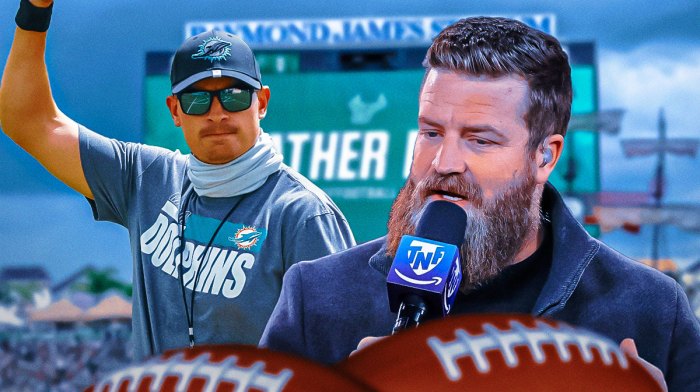 Former Tampa Bay Buccaneers star Ryan Fitzpatrick and offensive coordinator Josh Grizzard in front of Raymond James Stadium.