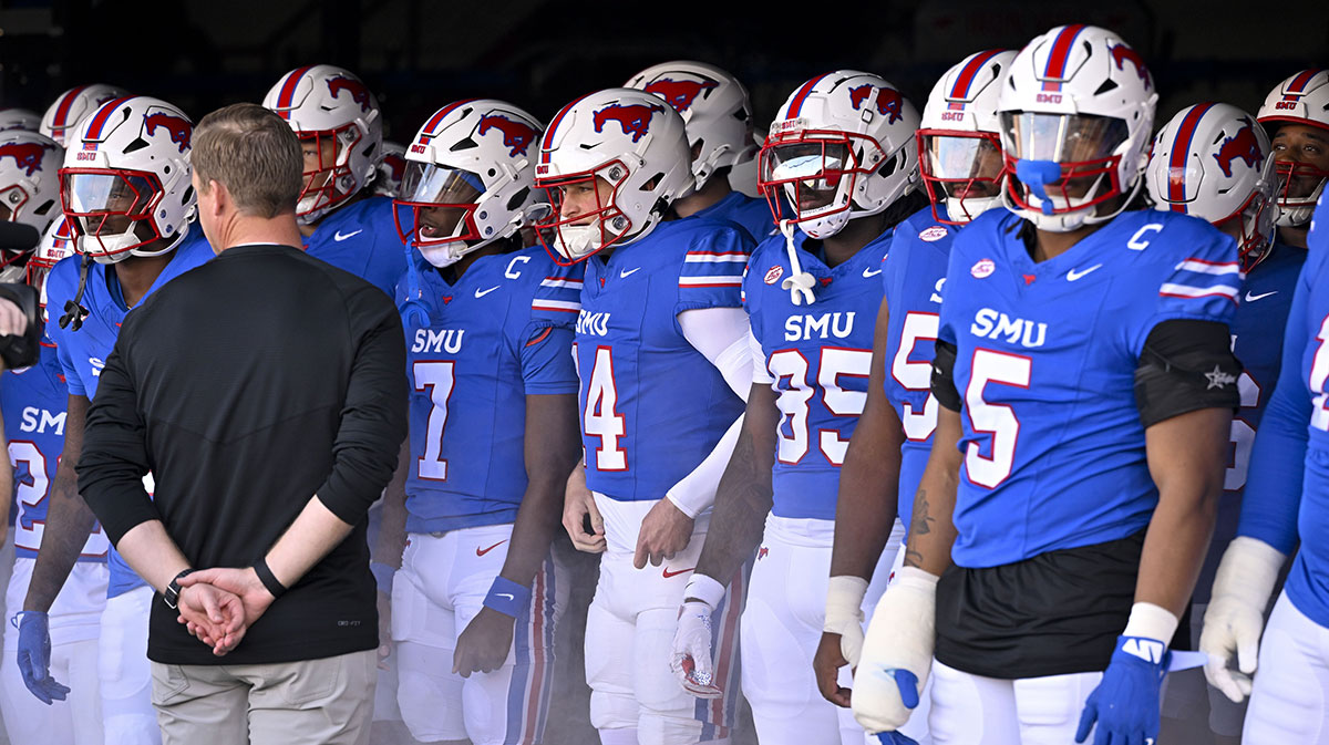 Nov 30, 2024; Dallas, Texas, USA; Southern Methodist Mustangs head coach Rhett Lashlee prepares to lead the Mustangs on to the field before the game between the SMU Mustangs and the California Golden Bears at Gerald J. Ford Stadium.