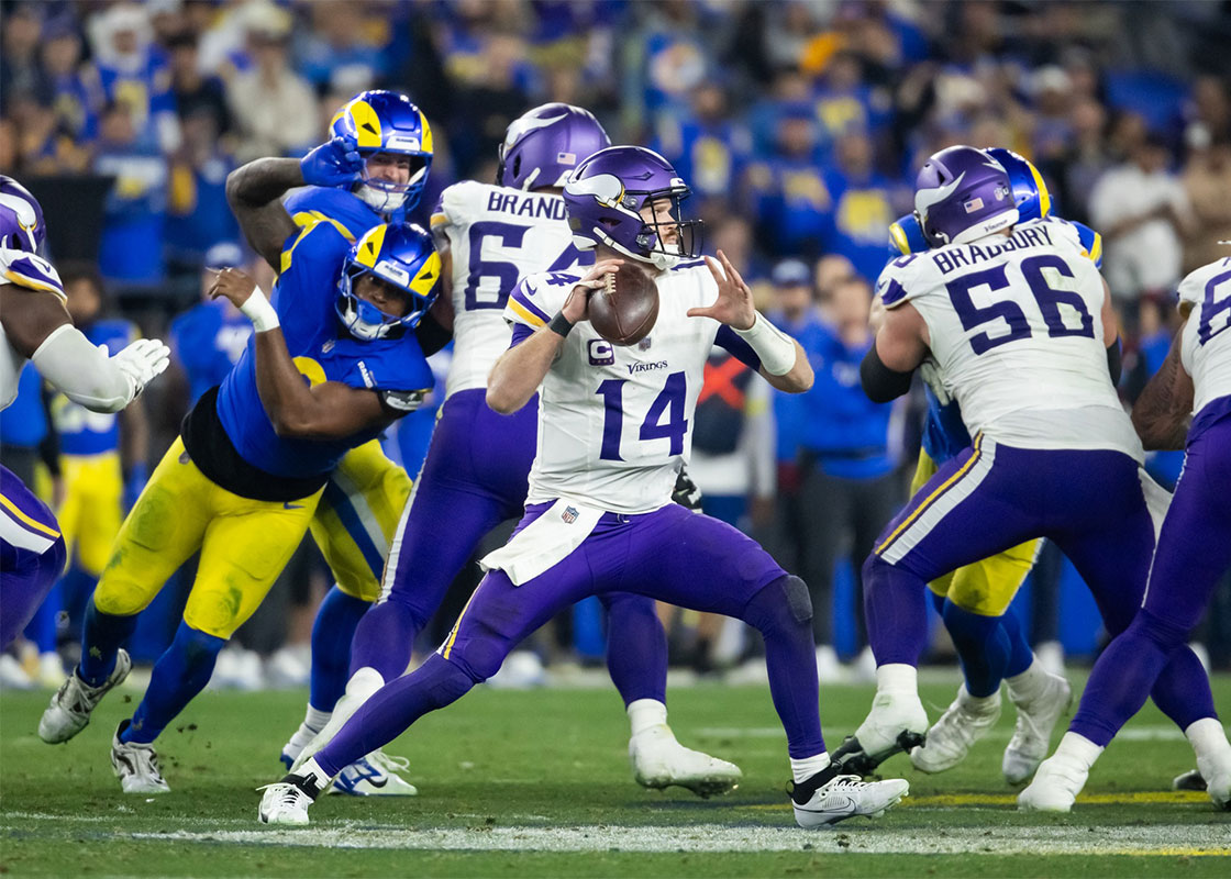 Jan 13, 2025; Glendale, AZ, USA; Minnesota Vikings quarterback Sam Darnold (14) against the Los Angeles Rams during an NFC wild card game at State Farm Stadium. 