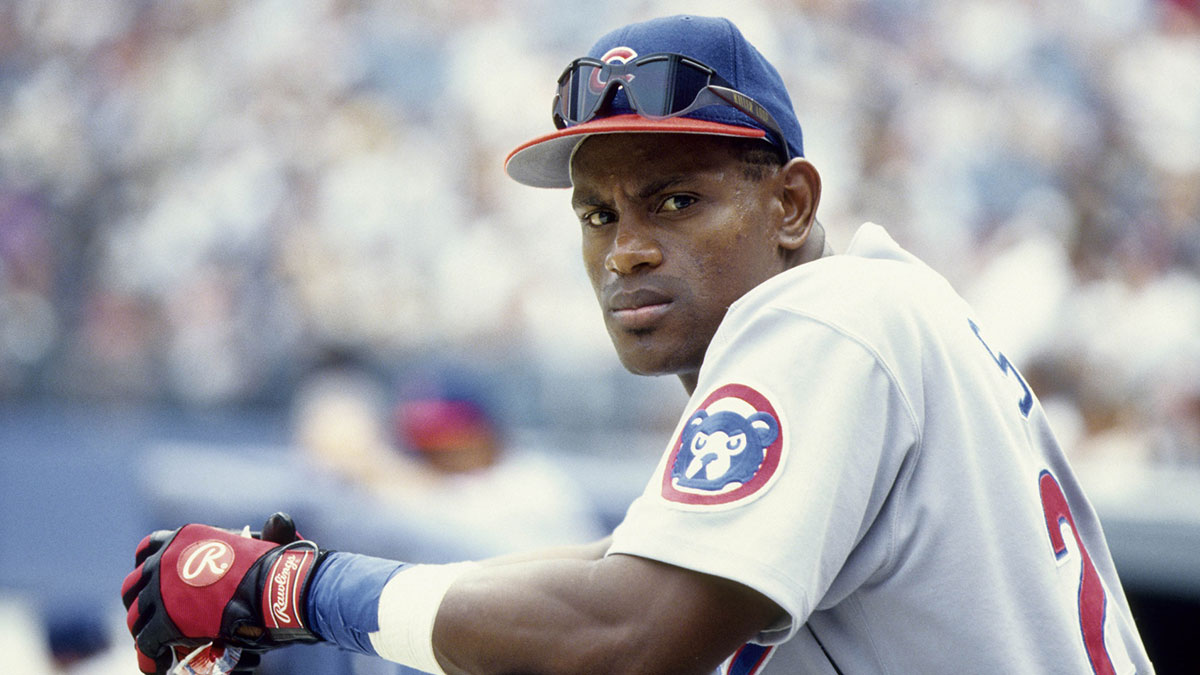 Chicago Cubs right fielder Sammy Sosa in the dugout at an unknown location. 