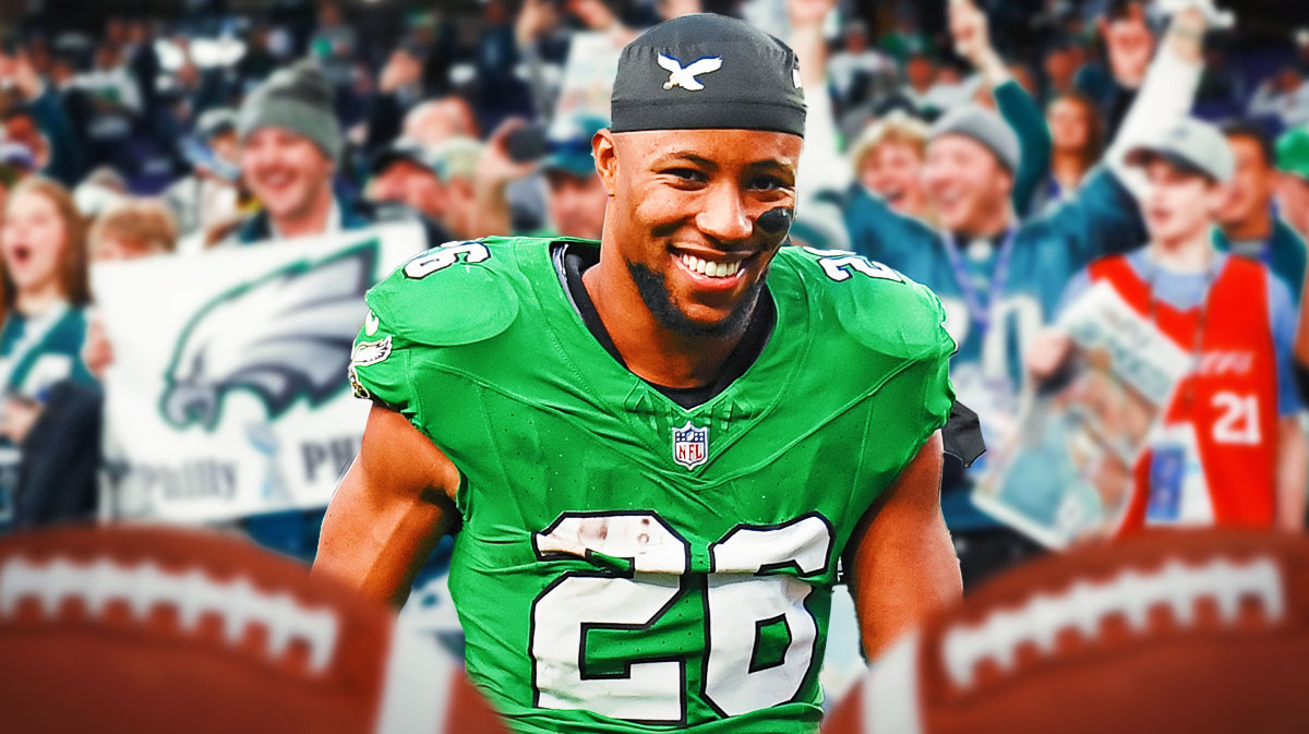 Photo: Saquon Barkley smiling in Eagles jersey, happy Eagles fans in background