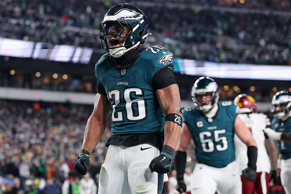 Philadelphia Eagles running back Saquon Barkley (26) celebrates after a touchdown against the Washington Commanders during the second half in the NFC Championship game at Lincoln Financial Field.