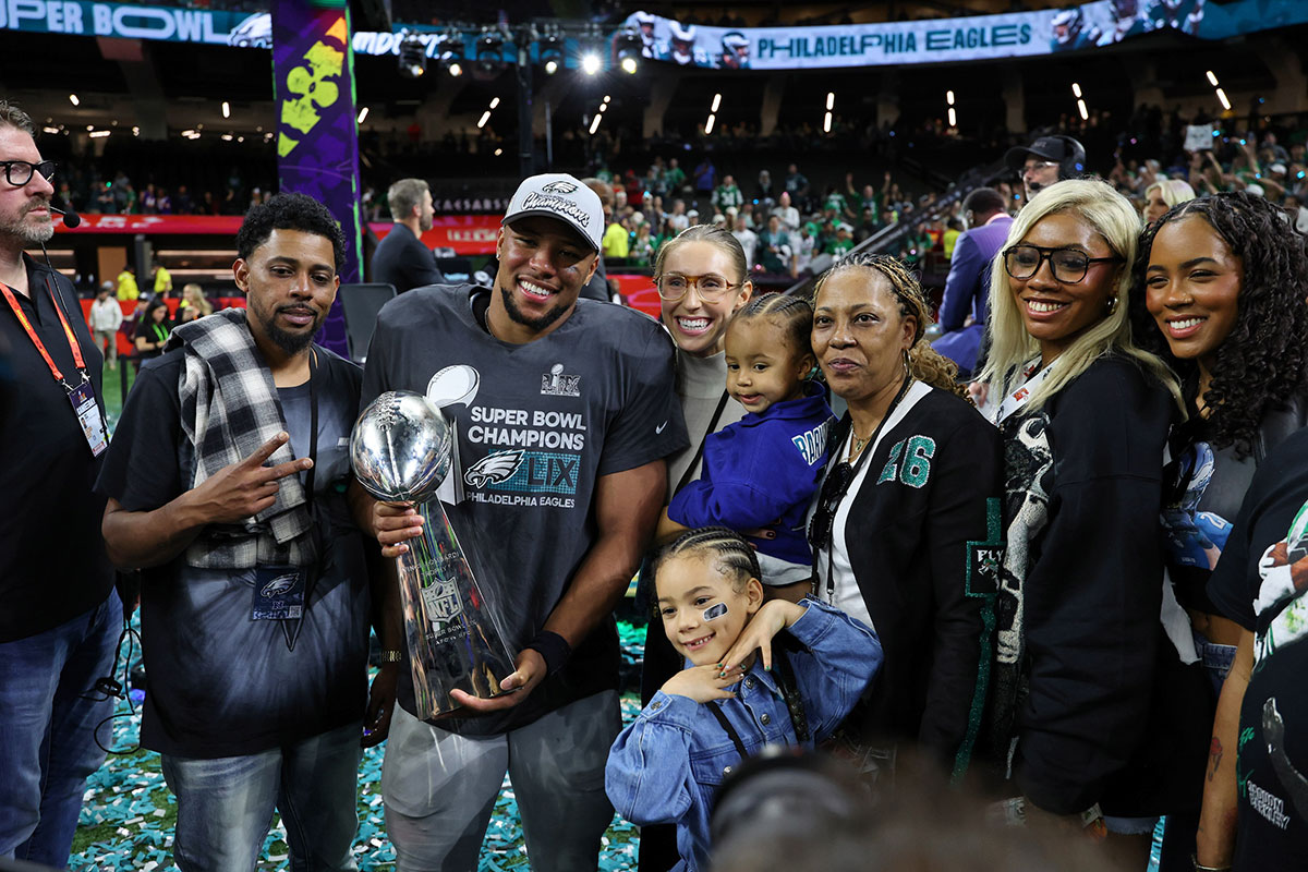 Saquon Barkleyholding the Lombardi Trophy after Super Bowl 59 on February 9, 2025.