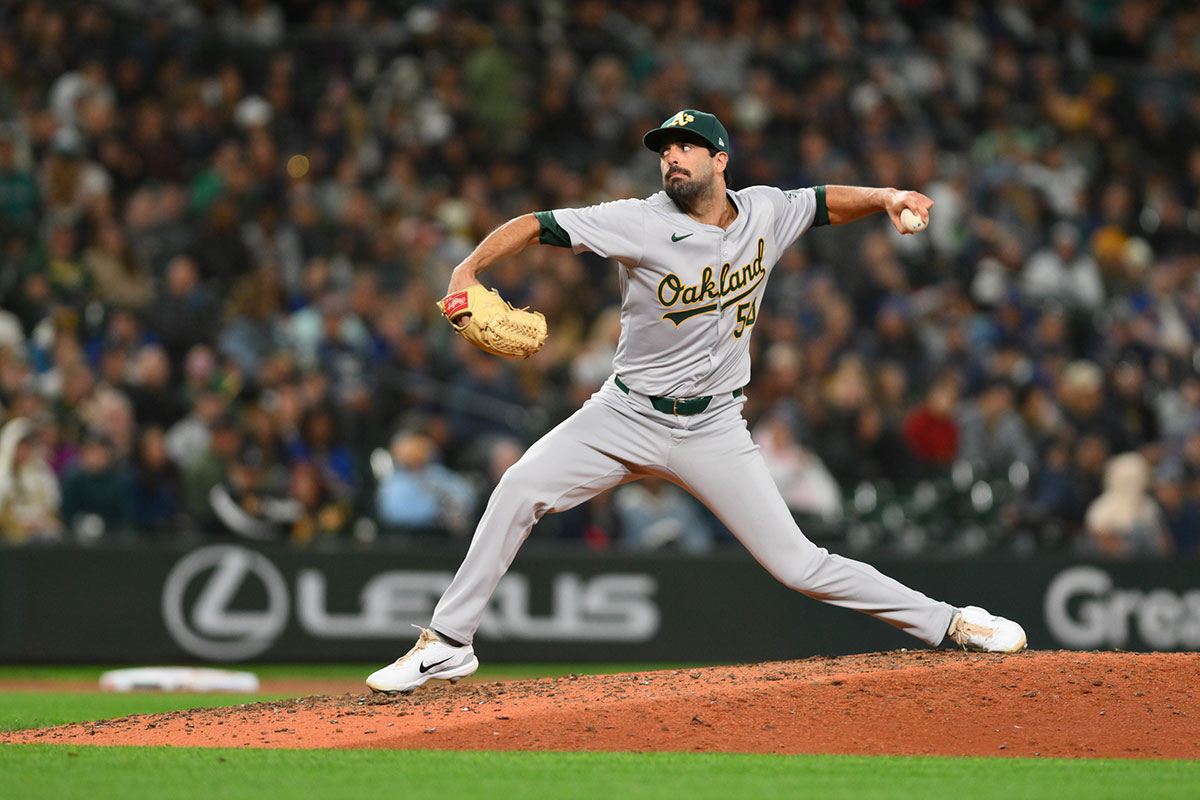 Oakland Athletics relief pitcher Scott Alexander (54) pitches to the Seattle Mariners during the eighth inning at T-Mobile Park.