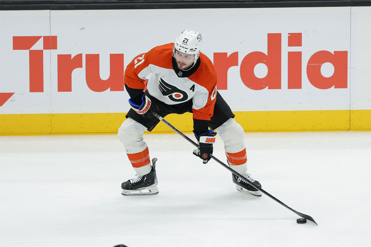 Philadelphia Flyers center Scott Laughton (21) controls the puck during the third period against the Utah Hockey Club at Delta Center.