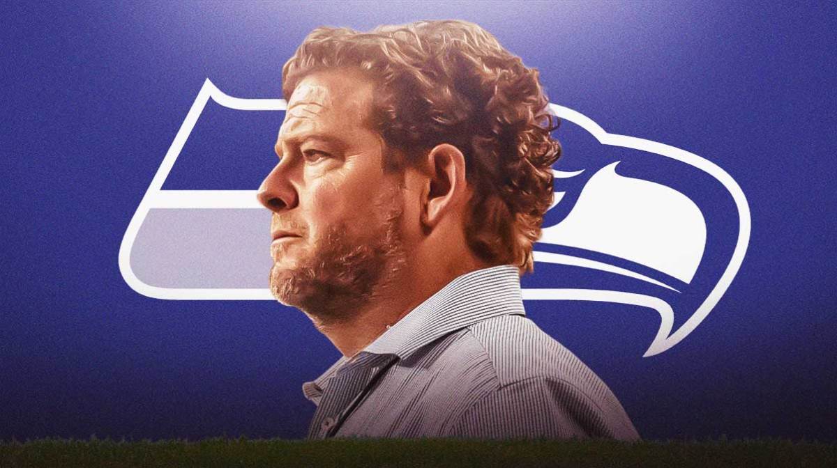 John Schneider Seahawks logo in the background.