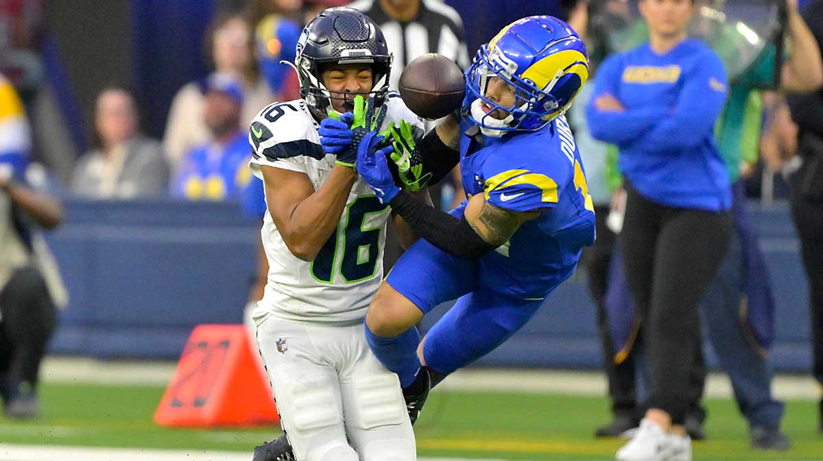 Los Angeles Rams cornerback Cobie Durant (14) breaks up a pass for Seattle Seahawks wide receiver Tyler Lockett (16) in the second half at SoFi Stadium.