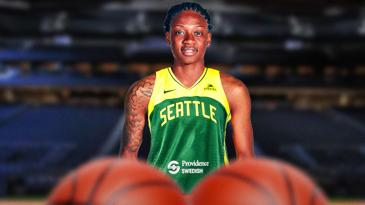 WNBA player Erica Wheeler in a Seattle Storm jersey with the Seattle Storm arena in the background, free agency signing