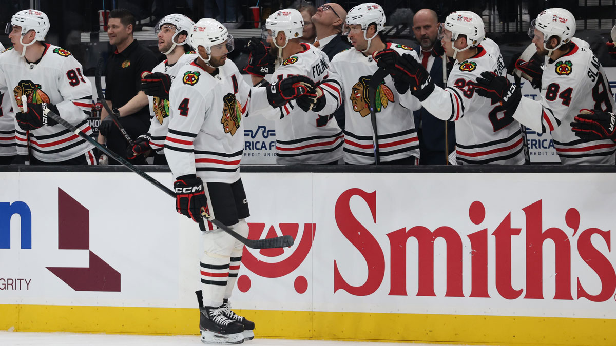 Chicago Blackhawks defenseman Seth Jones (4) celebrates a goal against the Utah Hockey Club with the bench during the first period at Delta Center.