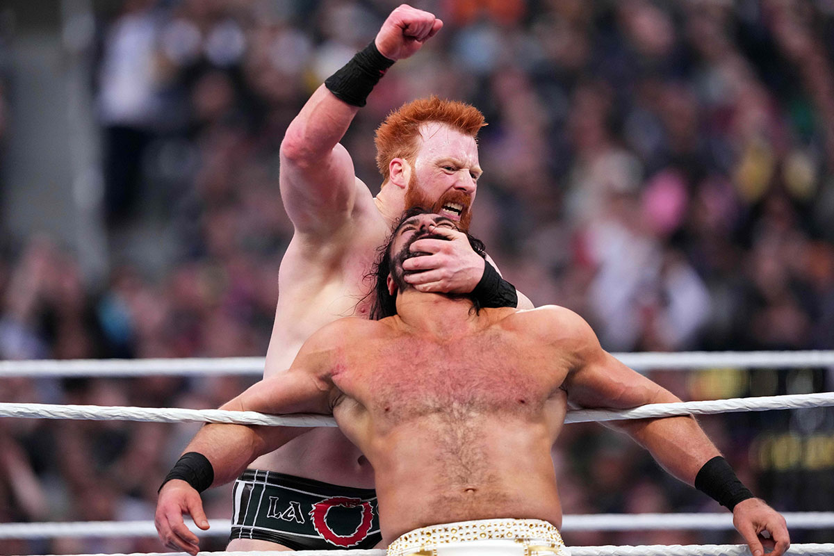 Sheamus and Drew McIntyre fighting at WrestleMania 39 during a triple threat match against Gunther.